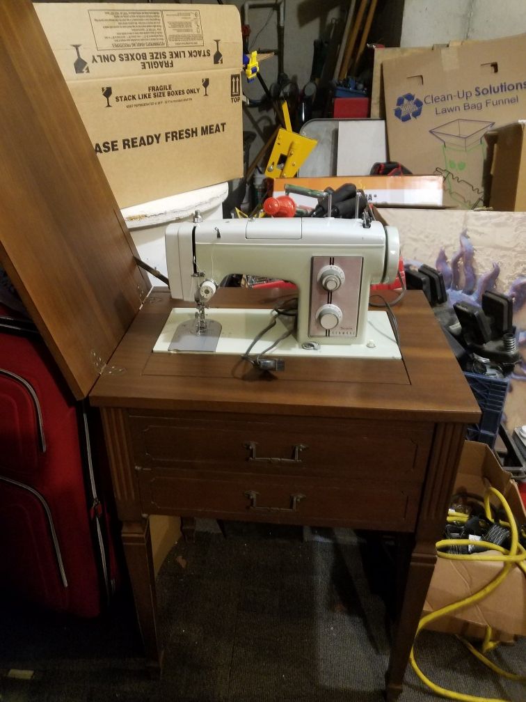 Antique Sears Kenmore sewing machine with built in table
