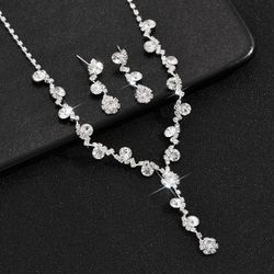 Silver crystal necklace and earrings set with rhinestone embellishments