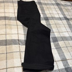 Stacked black denim jeans