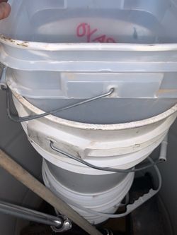 Many White Buckets Containers