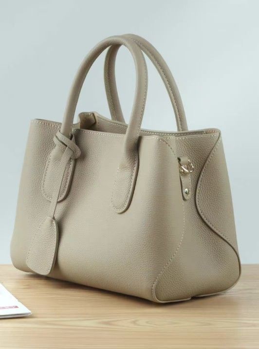 🔥2025 new] Leather Milk White Large Capacity Women's Bag Handheld Crossbody Commuting Mom Bag New Idle
 