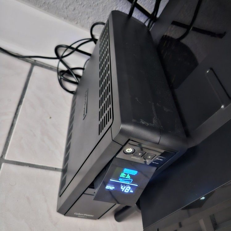 CyberPower CP1500PFCLCD PFC Sinewave UPS Battery Backup and Surge Protector, 1500VA/1000W, 12 Outlets, AVR, Mini Tower; UL Certified