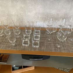 For sale pre-owned group of 20 beer, whiskey and wine glasses from the Crate&Barrel Store.