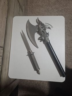 Ax with knife in handle