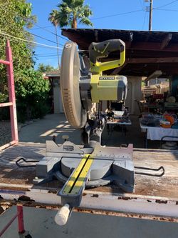 Ryobi 15 amp 12 in Miter Saw with attached scaffold.