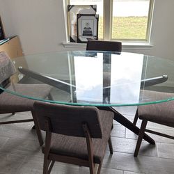 Oval glass dinning table with 4 chairs