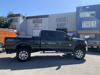 Ford F-250 Lift Kit with Steering Stabilizer And Tires