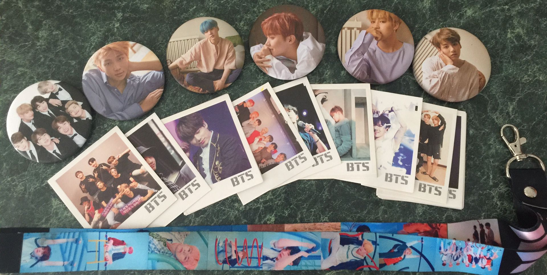 BTS photocards (22), pins, and lanyard