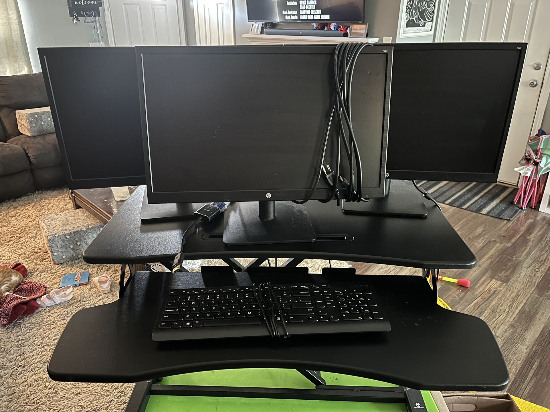 WFH Setup. 3 Monitors With Standing Desk And Keyboard 