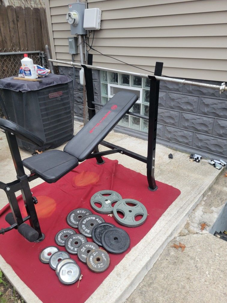 MARCY. BENCH WITH 120LBs  OF 1" HOLE PLATES. 
 2-25s. 4-10s.  4-5s. 4-2.5s. 
6' STRAIGHT BAR WITH COLLARS 
11525 S HALSTED DUNKIN DONUTS/ 7111.S WESTE