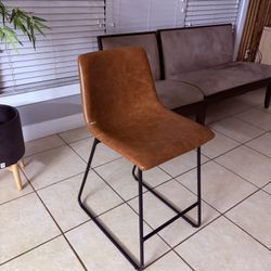 One (1) Modern Brown Stool, 35” from top to bottom; 24” from floor to seat ( yes it’s available!) $5