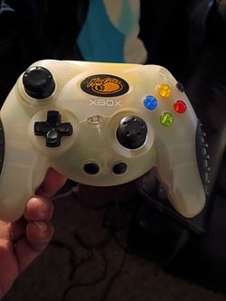 Mad Catz Xbox Controller Clear White and a black controller
