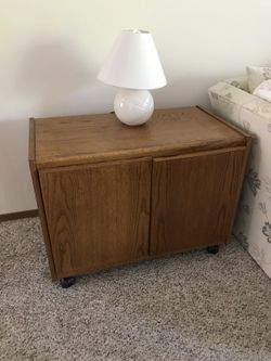 End table with cabinet on wheels
