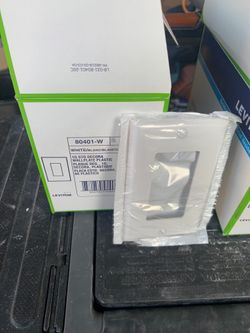 Leviton white square outlet faceplate. 150 available