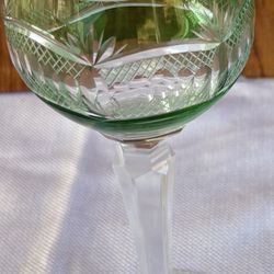 pair of vintage (likely 1970s-era) green cut-to-clear crystal wine glasses (or hock-style goblets) made in Poland.