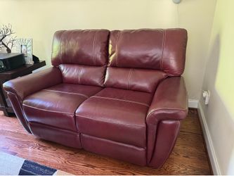 Burgundy / wine red leather love seat sofa