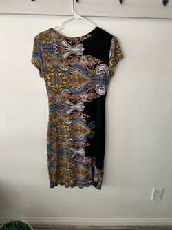 Women’s super cute dress. Front cinch waist design, ruffled bottom edge and cap sleeve. Modern paisley design, ONLY $10,  size 10