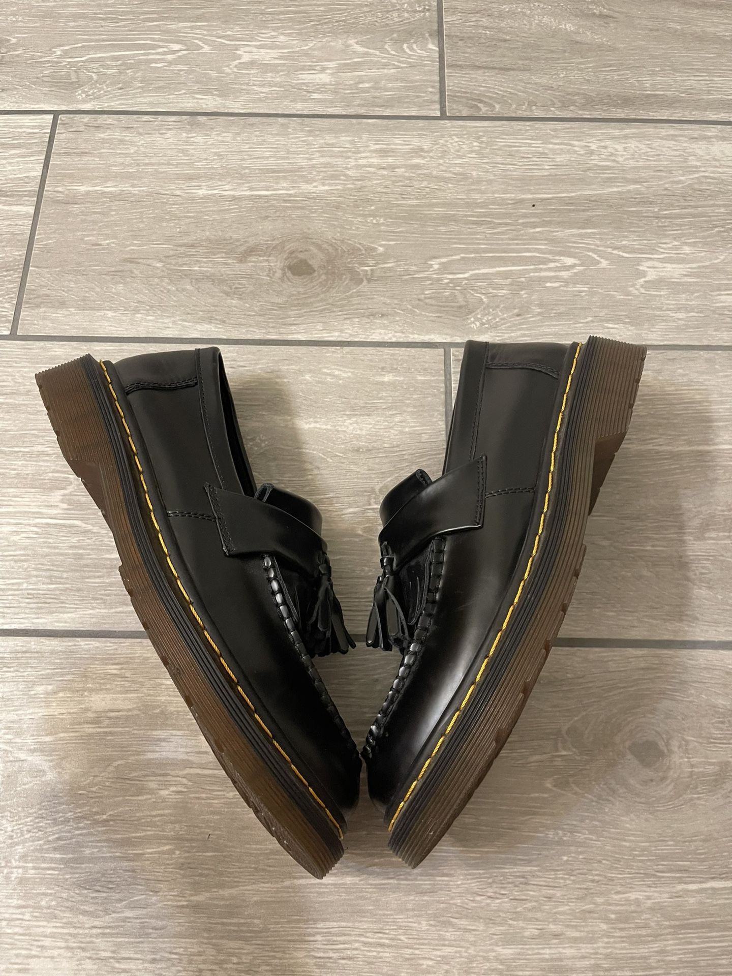 Dr. Martens Adrian Tassel Loafers in black smooth leather with yellow welt
