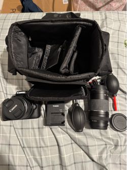 Canon EOS Rebel T100 camera w/bag , 18-55mm lens, 75-300 lens