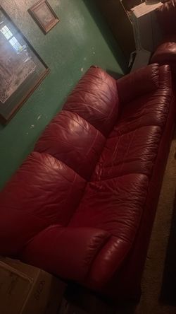 Red leather sofa and matching love seat