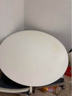 Kitchen white table with wood leg color including 3 chairs with dark blue chair seat pad