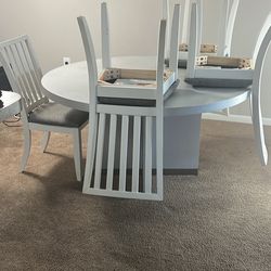 Real Wood Table And Four Chairs