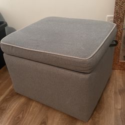 Davinci owen upholstered swivel glider with side pocket and storage ottoman sale