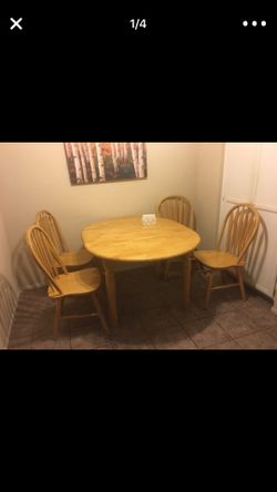 Oak dining table with four chairs