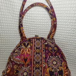 Vera bradley purse with snap clasp closure.  9 1/2" T X 13" W plenty of storage space . Great condition.  Smoke free home. 