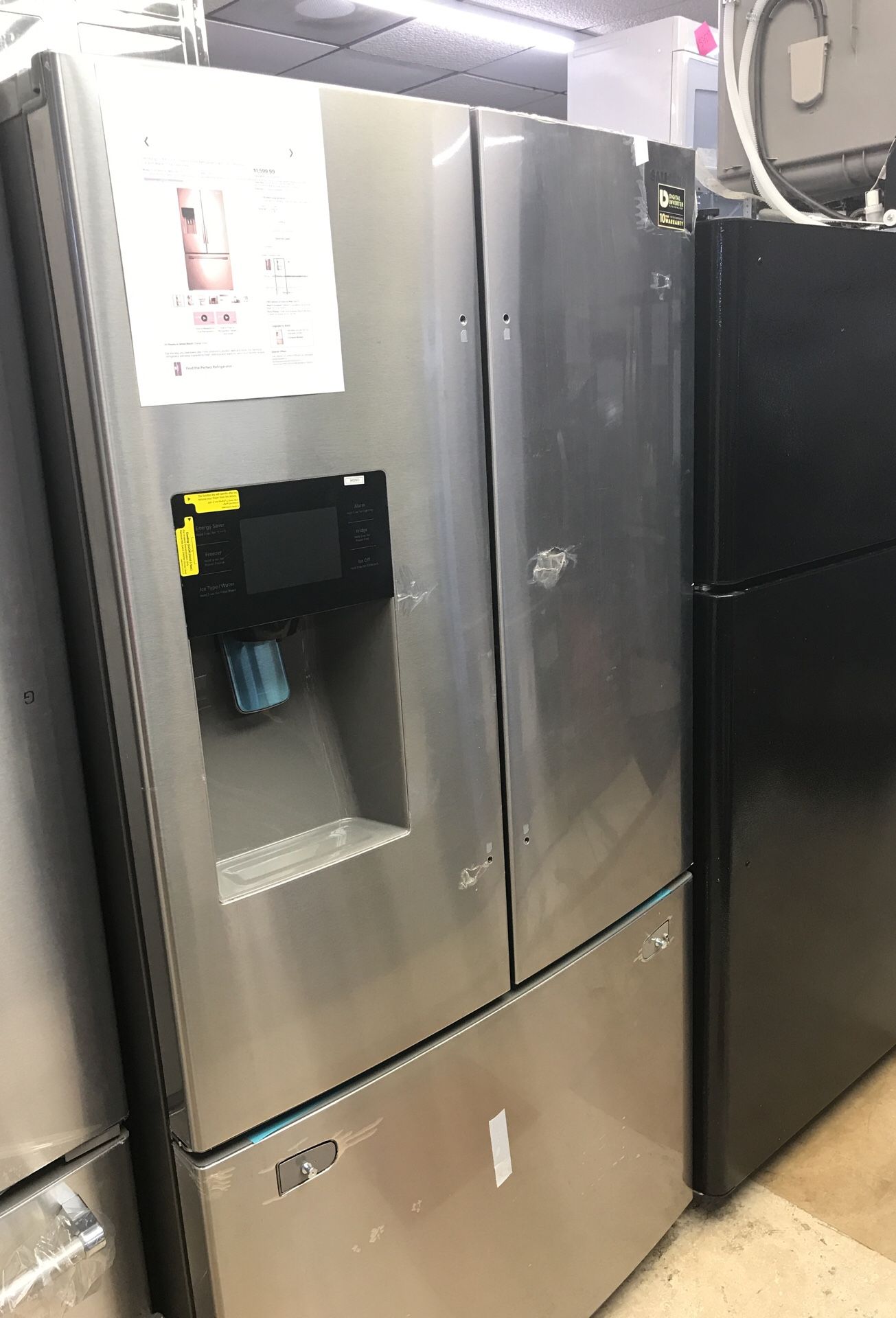 Samsung 24.6 cu ft French Door Refrigerator with Thru the Door Ice and water stainless steel model # RF263BEAESR