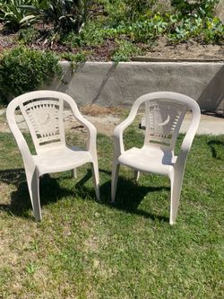 2 outdoor plastic chairs  both for $25