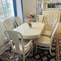 Large pedestal table with two leaves plus six chairs, two of which have arms. 88"L x 42"W x 30"H White washed oak color. Will need a truck to pick up.