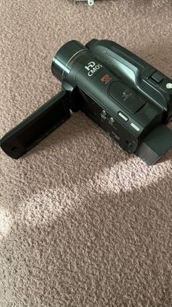 Canon HD Vixia Camcorder with SD hard drive with two lenses,, and the battery and charger.