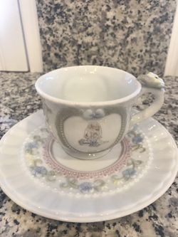Precious Moments Tea cup and saucer