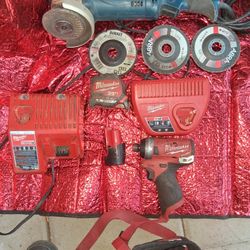 Milwaukee M12 Fuel Impact Driver With Battery And Two Chargers One Is For Both Types Of Batteries Also A Milwaukee 25ft Tape  Milwaukee Drywall Knife 