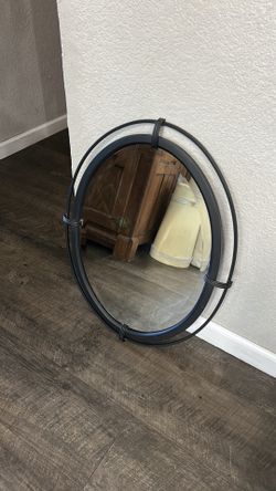 Oval metal mirror