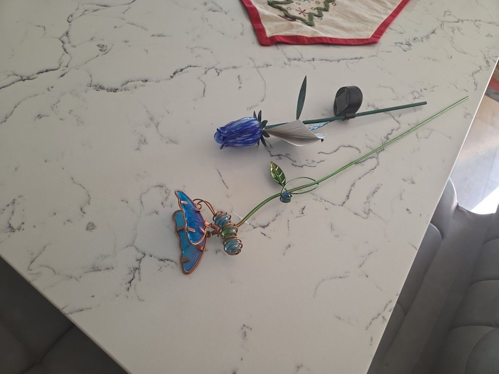 Two Outdoor Plant Accessories The Tulip Is Solar, Butterfly Is Sparkly With Marbles In Its Body