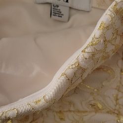 White dress with gold embroidery