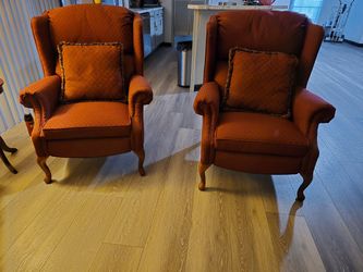 Two recliner burgundy standard chairs Two recliner burgundy standard chairs