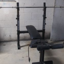 Weight Lifting Bench Press With Leg Lift