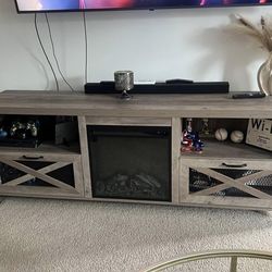 Rustic gray TV stand with electric fireplace
