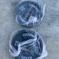 Very nice looking Brand new 45, 35 lb, and 25 lb Olympic weight plates.  Pair of 45s =$110 Pair of 35s=$90 Pair of 25s=$80
