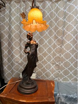 Two bronze night lamps with Venetian glass shades. Dimensions: 36 inches high, 8 inches wide; weight: 10 pounds each.