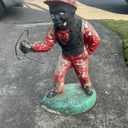 Jocko concrete yard statue in decent shape. Was wired at one point for the lantern. Very antique.   $200, or best offer, cash or Venmo, meet in person