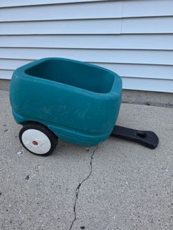 Step 2 Tag Along Wagon Trailer in teal, featuring a single axel and wheels.