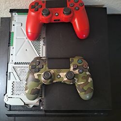 PlayStation 4 console with 2 DualShock controllers.