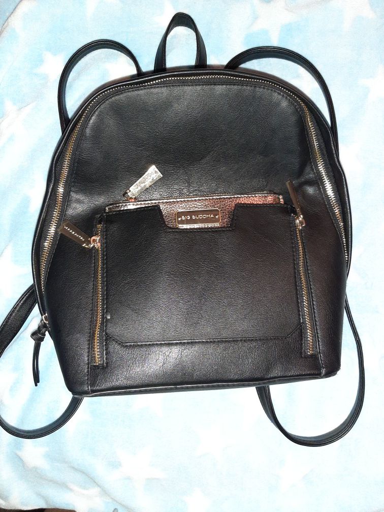Big Buddha black faux leather mid size backpack. Removable metallic accessories bag. Great condition.