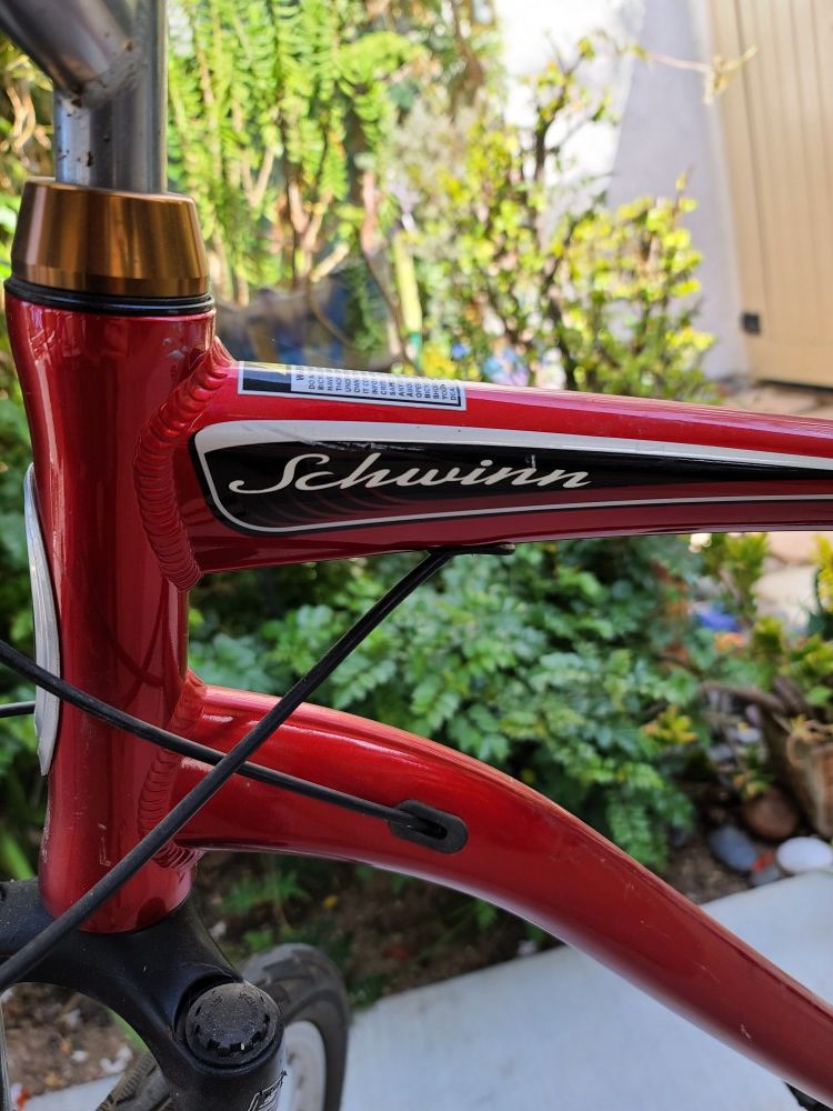 Red Schwinn hybrid bike