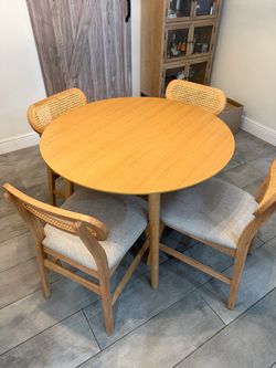Round Wood Dining Table with 4 Cane-Back Chairs