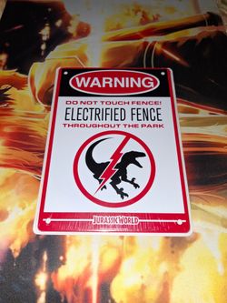 JURASSIC WORLD WARNING ELECTRIFIED FENCE MINI METAL SIGN...NEW & UNUSED...ADULT OWNED AND KEPT IN A SMOKE FREE HOME...$15 OBO...